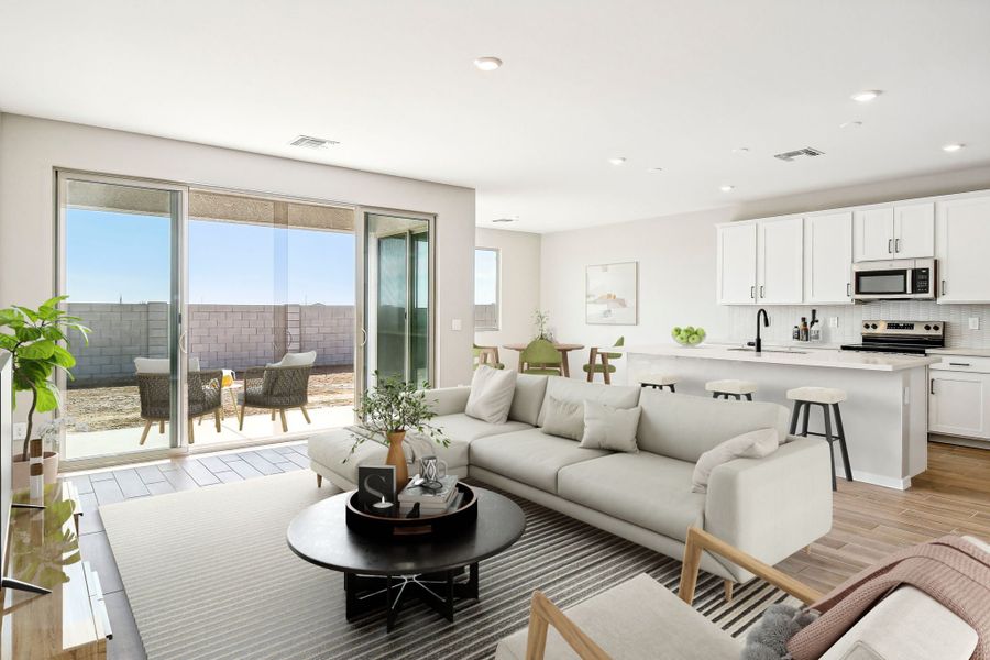 Great room and kitchen; actual finishes vary by community. This image has been digitally staged