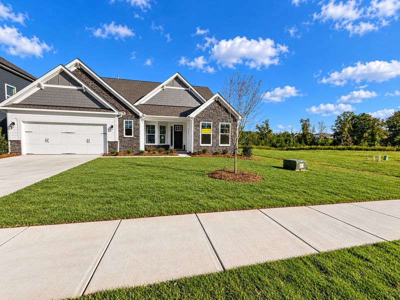 Front exterior of a new home in The Enclave at Laurelbrook, Sherrills Ford, NC, highlighting curb appeal (Image 1). Front exterior of a new home in The Enclave at Laurelbrook, Sherrills Ford, NC, highlighting curb appeal (Image 1).