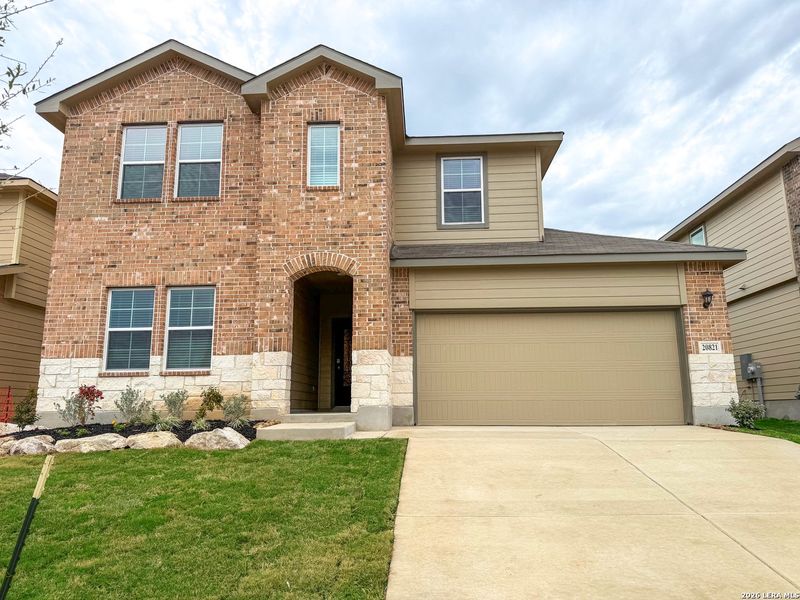 Front exterior of a new home in Brookstone Creek, San Antonio, TX, highlighting curb appeal (Image 1). Front exterior of a new home in Brookstone Creek, San Antonio, TX, highlighting curb appeal (Image 1).