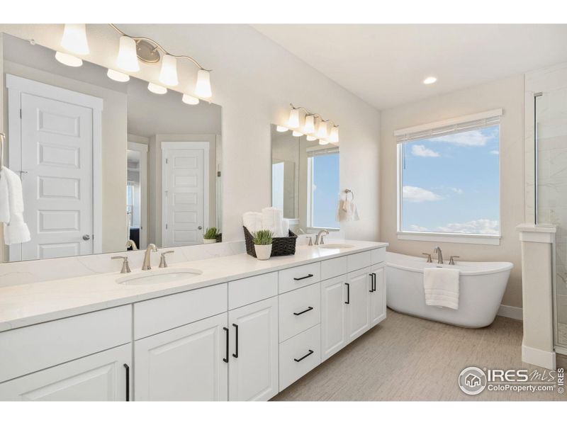 Luxurious five-piece, spa-inspired bath! New Venatino quartz countertop with double sinks!