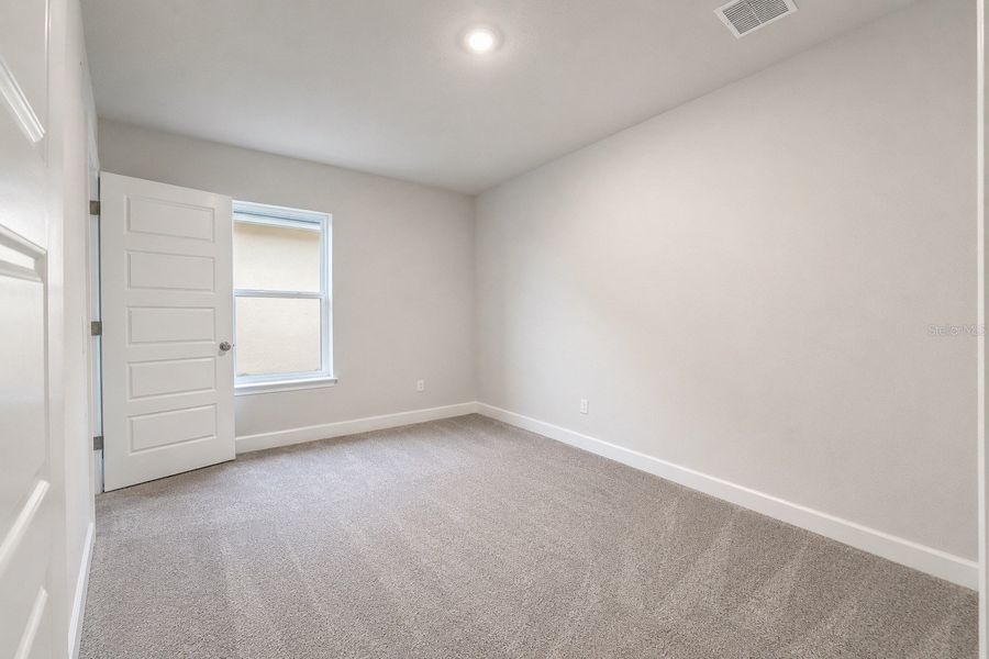 Spacious, unfurnished interior of a new home in Harmony Central, St. Cloud (Image 14).