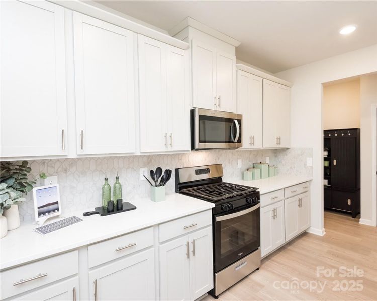 Photo is not of the actual home, but is an inspirational photo of builder’s model home and may depict options, furnishings, and/or decorator features that are not included