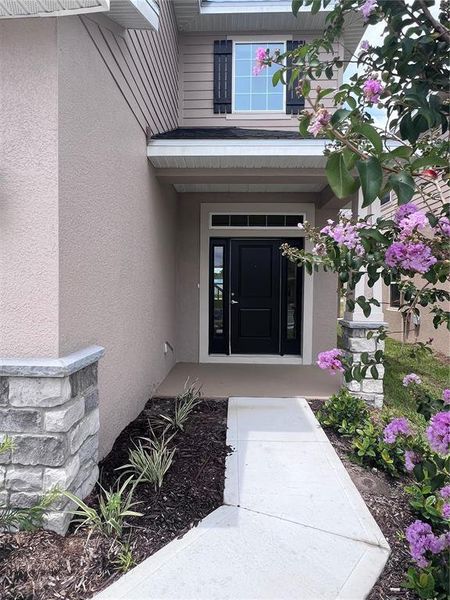 Front exterior of a new home in Harmony Central, Harmony, FL, highlighting curb appeal (Image 1). Front exterior of a new home in Harmony Central, Harmony, FL, highlighting curb appeal (Image 1).
