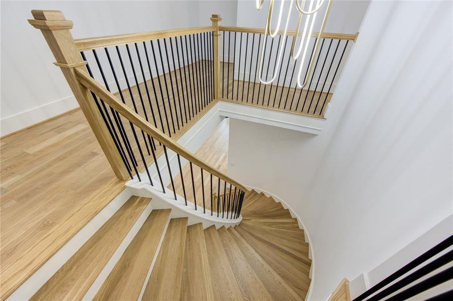 Beautifully crafted Circular Stair, Wide Hallway, Solid White Oak Hardwood.