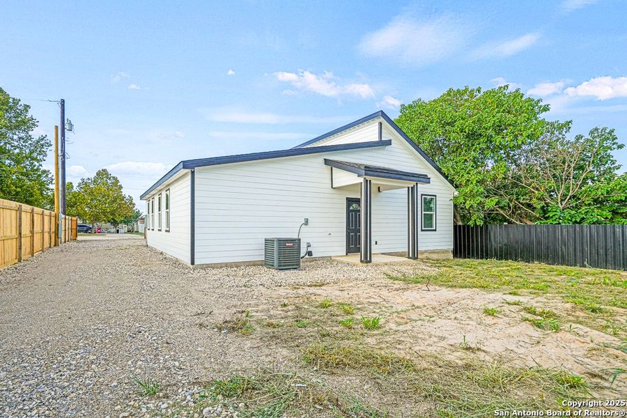Front exterior of a new home in , Von Ormy, TX, highlighting curb appeal (Image 13). Front exterior of a new home in , Von Ormy, TX, highlighting curb appeal (Image 13).