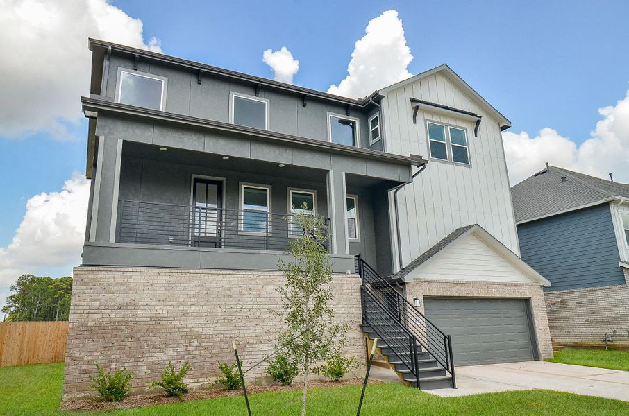 The dark and light siding compliments the brick exceptionally well, creates an amazing curb appeal. The dark and light siding compliments the brick exceptionally well, creates an amazing curb appeal.