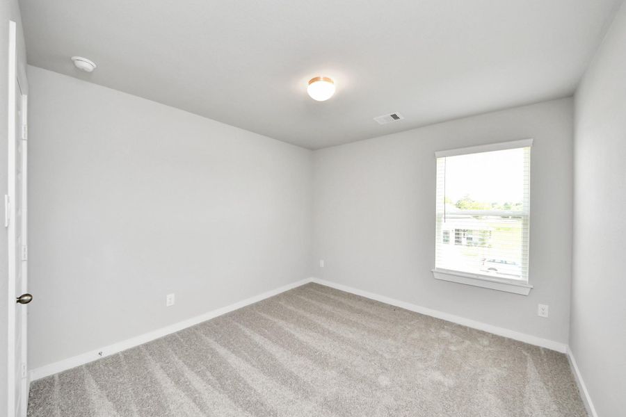 Secondary bedroom features plush carpeting, large windows that let in plenty of natural light, bright paint, and spacious closets. Secondary bedroom features plush carpeting, large windows that let in plenty of natural light, bright paint, and spacious closets.