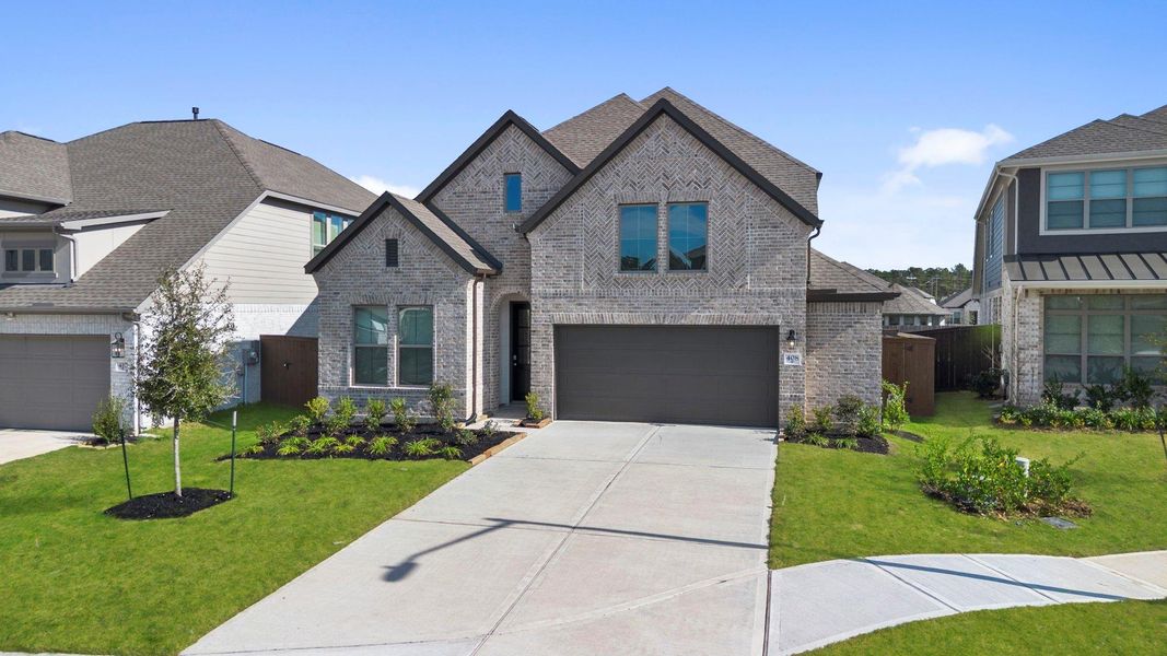 Front exterior of a new home in The Trails 50', New Caney, TX, highlighting curb appeal (Image 20).