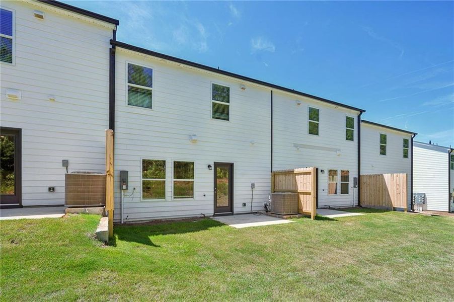 Front exterior of a new home in Avalon - Parc Series, Conyers, GA, highlighting curb appeal (Image 2). Front exterior of a new home in Avalon - Parc Series, Conyers, GA, highlighting curb appeal (Image 2).