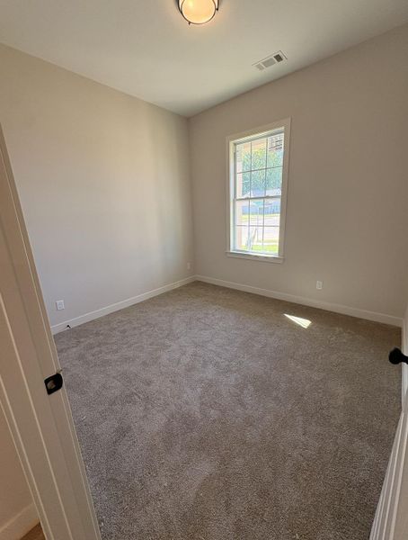 Neutral wall finishes, recessed window, and flush mount lighting Neutral wall finishes, recessed window, and flush mount lighting