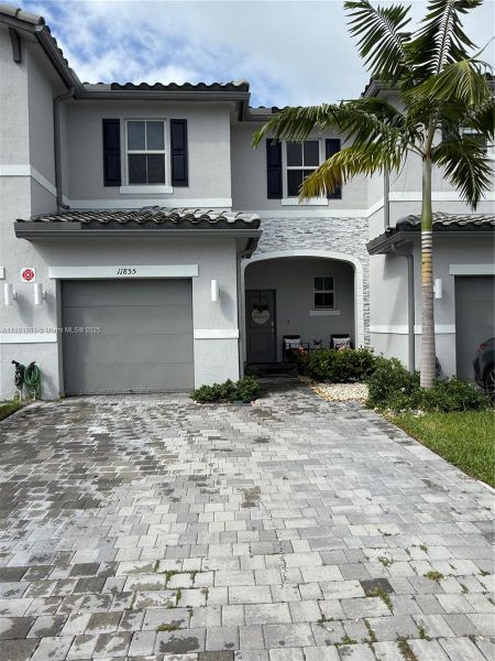 Front exterior of a new home in , Coral Springs, FL, highlighting curb appeal (Image 16). Front exterior of a new home in , Coral Springs, FL, highlighting curb appeal (Image 16).