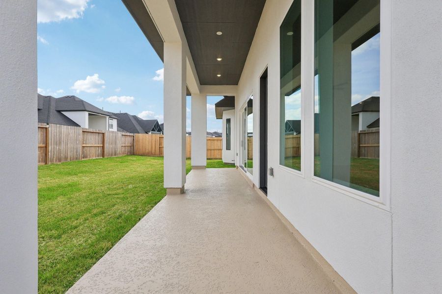 Exterior details and patio area of a home in Sienna 65', Missouri City (Image 17).