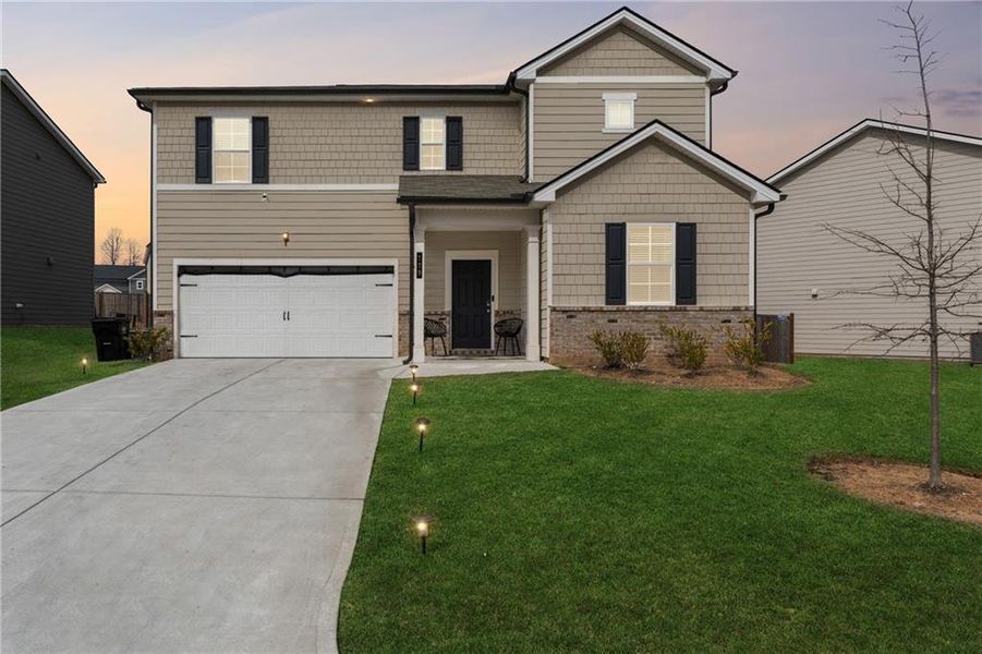 Front exterior of a new home in Summit Pointe, Dallas, GA, highlighting curb appeal (Image 1). Front exterior of a new home in Summit Pointe, Dallas, GA, highlighting curb appeal (Image 1).