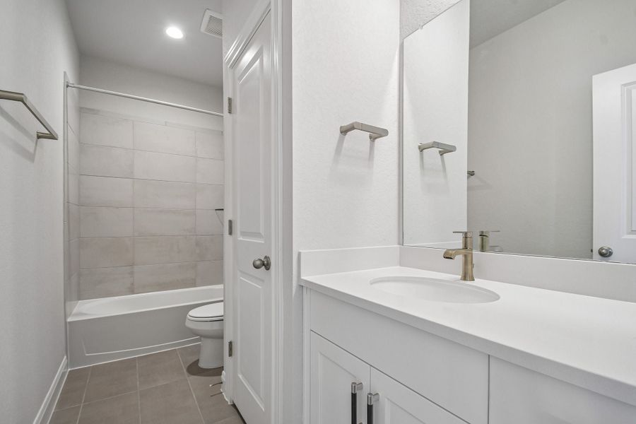 Furnished interior view inside a new home in 6 Creeks, Kyle (Image 11).