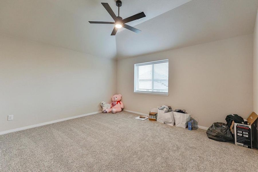 Spacious secondary bedroom features natural light, ceiling fan and like new carpet Spacious secondary bedroom features natural light, ceiling fan and like new carpet