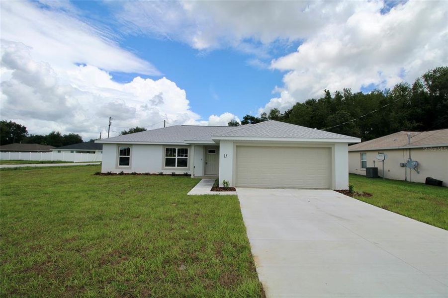 Front exterior of a new home in , Ocala, FL, highlighting curb appeal (Image 1).
