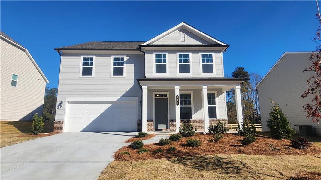 Front exterior of a new home in The Estates at Casteel, Bethlehem, GA, highlighting curb appeal (Image 2).