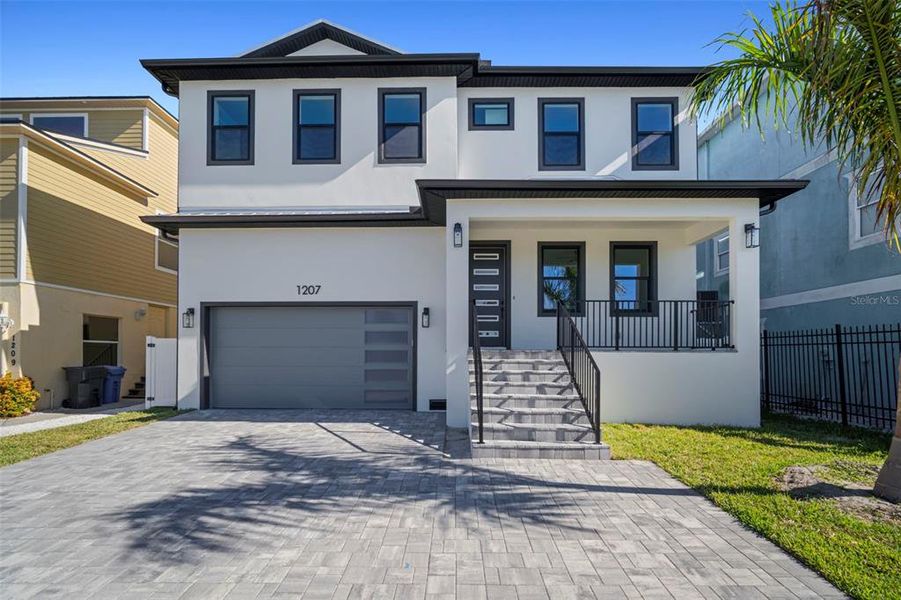 Front exterior of a new home in , Apollo Beach, FL, highlighting curb appeal (Image 1).