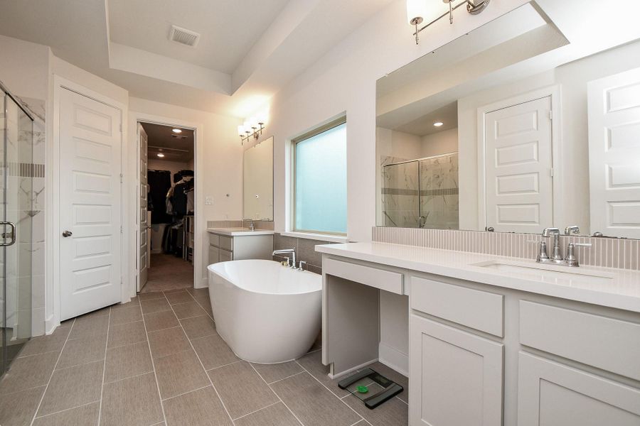 Cool, soothing walls are complemented by earth toned tile flooring; with dual/separate sinks/vanity and the star of the show, the freestanding modern oval tub, under a large frosted glass window. And, straight ahead, up center, is your primary walk-in closet. Cool, soothing walls are complemented by earth toned tile flooring; with dual/separate sinks/vanity and the star of the show, the freestanding modern oval tub, under a large frosted glass window. And, straight ahead, up center, is your primary walk-in closet.
