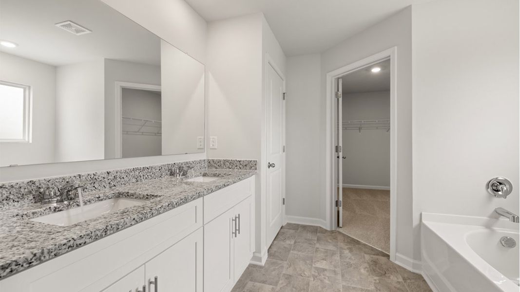 Representative furnished interior of a home built from the Mansfield by D.R. Horton in Highland Hills, Graniteville (Image 8).