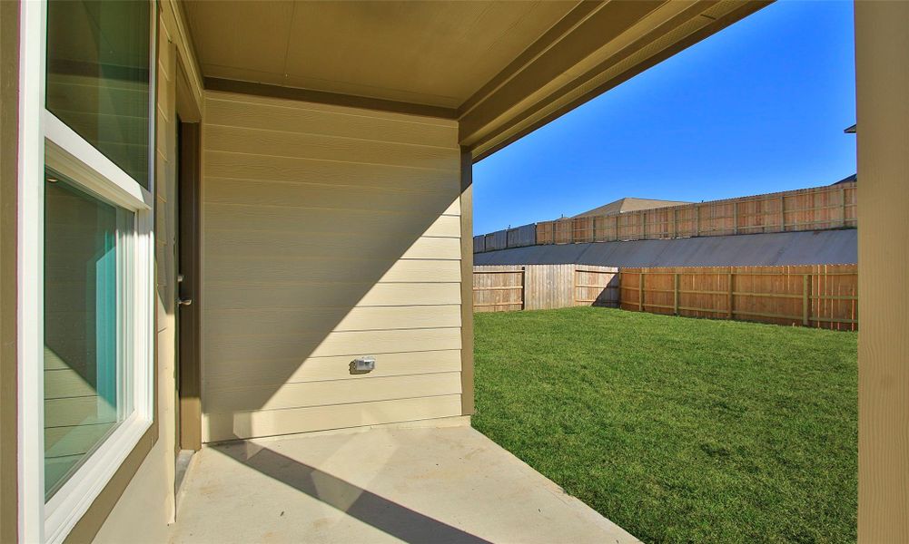 Exterior details and patio area of a home in Mostyn Springs, Magnolia (Image 17).
