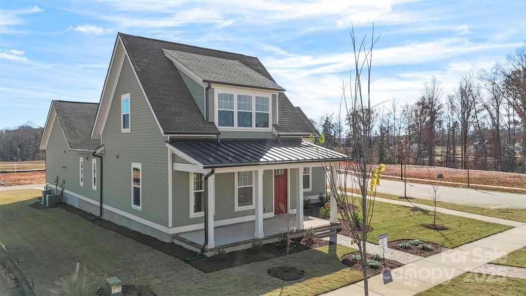 Front exterior of a new home in Riverwalk, Rock Hill, SC, highlighting curb appeal (Image 1).