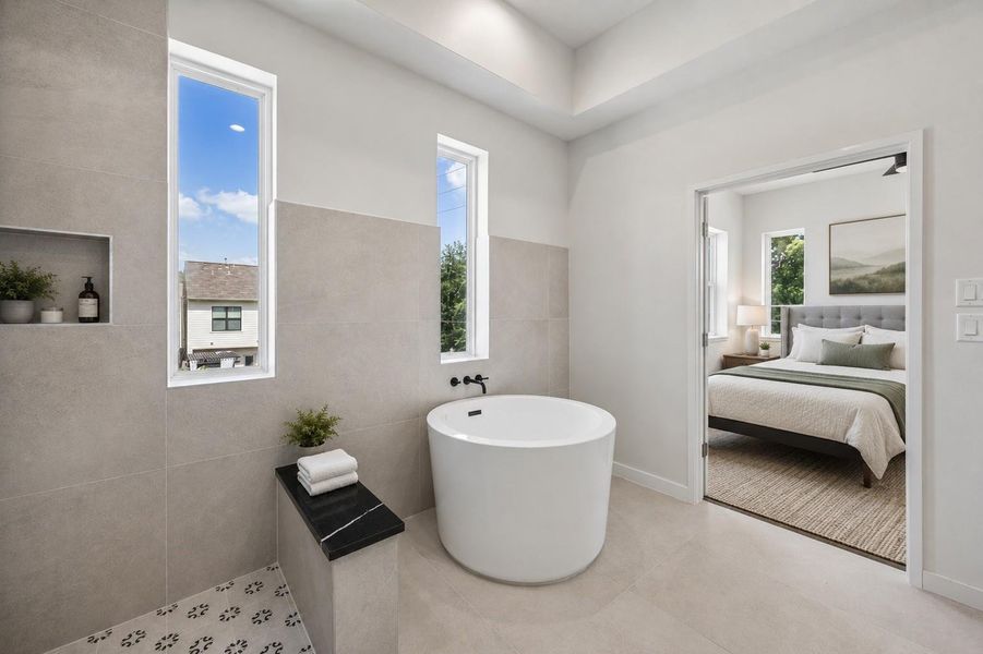 A freestanding soaking tub anchors the spa inspired primary bath, creating a peaceful retreat for everyday relaxation. A freestanding soaking tub anchors the spa inspired primary bath, creating a peaceful retreat for everyday relaxation.