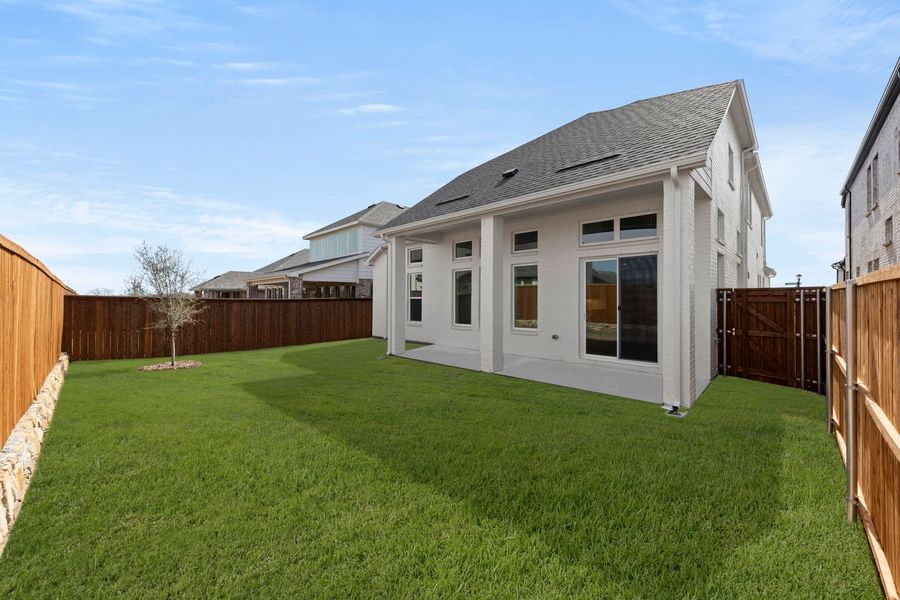 Exterior details and patio area of a home in Lily Creek at Sutton Fields, Aubrey (Image 23). Exterior details and patio area of a home in Lily Creek at Sutton Fields, Aubrey (Image 23).