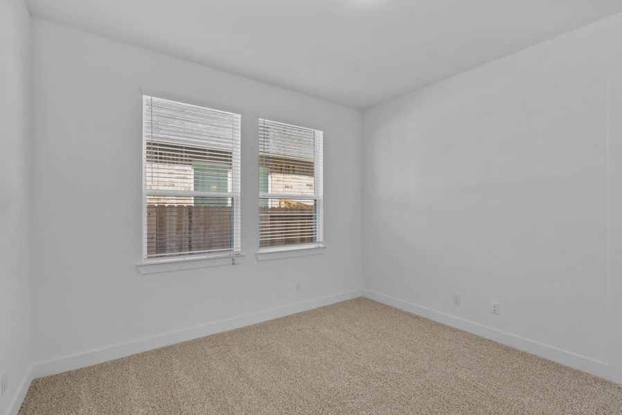 Representative unfurnished interior of a home built from the Nicklaus by Chesmar Homes in Riceland Alley Loads, Mont Belvieu (Image 58).