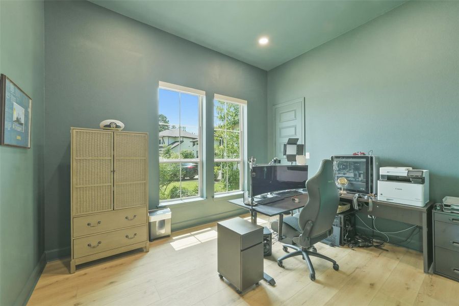 Guest bedroom being used as an office. Seller did add wood flooing in this room.