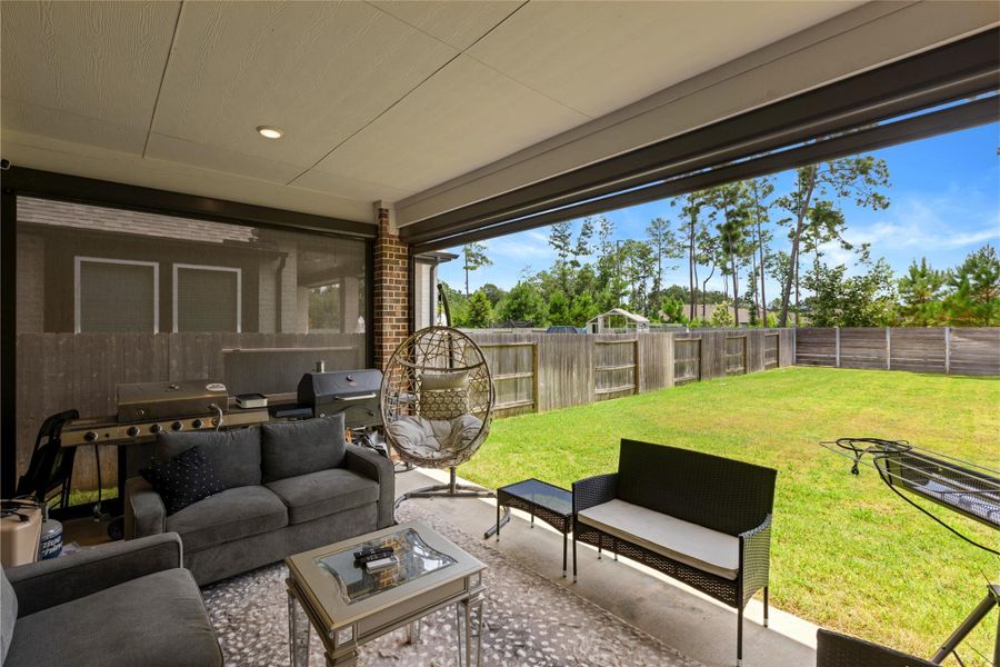 Covered patio with remote controlled screen, one of multiple upgrades done by the Owner. Covered patio with remote controlled screen, one of multiple upgrades done by the Owner.