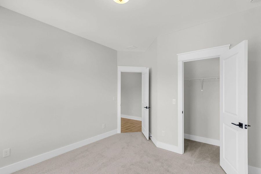 Spacious, unfurnished interior of a new home in Tidewater at Lakes of Cane Bay, Summerville (Image 49).