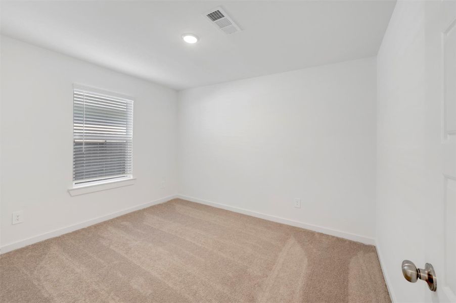 Spacious, unfurnished interior of a new home in Pinewood at Grand Texas, New Caney (Image 37).