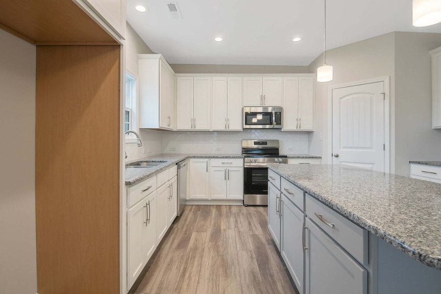 Representative furnished interior of a home built from the Drayton by Caviness & Cates Communities in Bartlett Manor, Youngsville (Image 151).