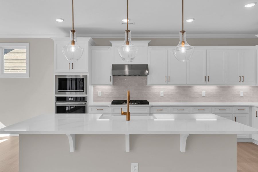 Representative furnished interior of a home built from the The Bradley by RobuckHomes in Windwater, Hampstead (Image 48).