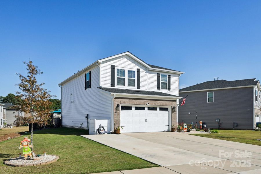 Front exterior of a new home in Monterey Park, York, SC, highlighting curb appeal (Image 1). Front exterior of a new home in Monterey Park, York, SC, highlighting curb appeal (Image 1).