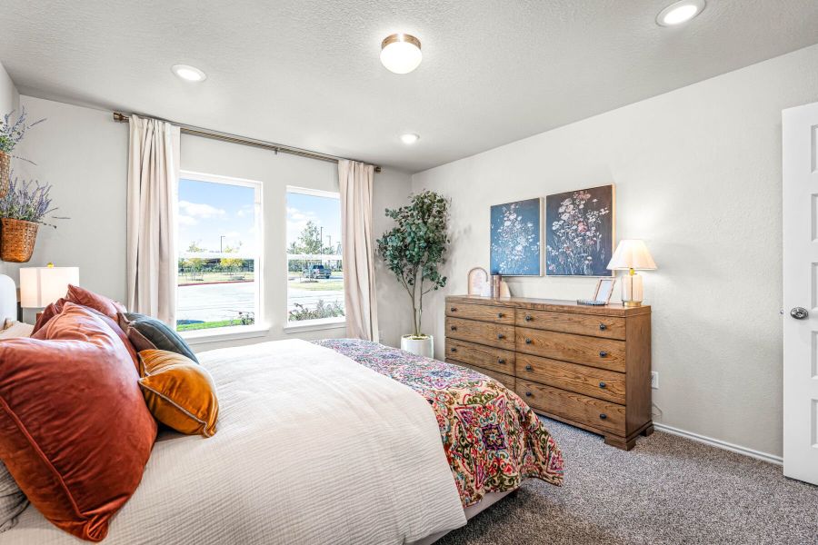 These are the secondary bedrooms of the Hawkins plan and is the model home in Carillon at 13305 Eppright Trace Blvd., Manor, TX. These are the secondary bedrooms of the Hawkins plan and is the model home in Carillon at 13305 Eppright Trace Blvd., Manor, TX.