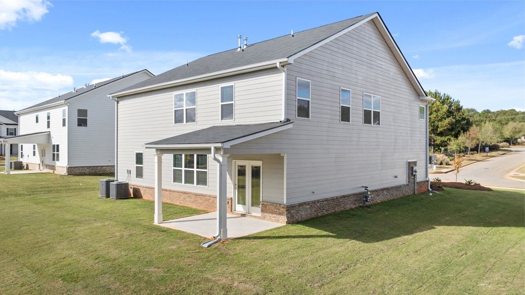 Exterior details and patio area of a home in Brooks Station, Dacula (Image 2).