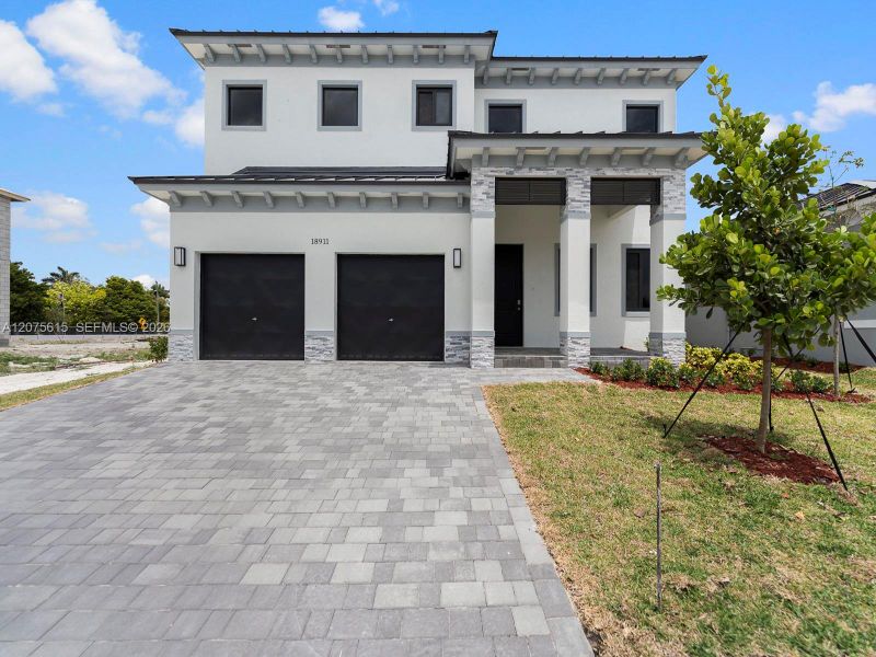 Front exterior of a new home in , Homestead, FL, highlighting curb appeal (Image 21). Front exterior of a new home in , Homestead, FL, highlighting curb appeal (Image 21).