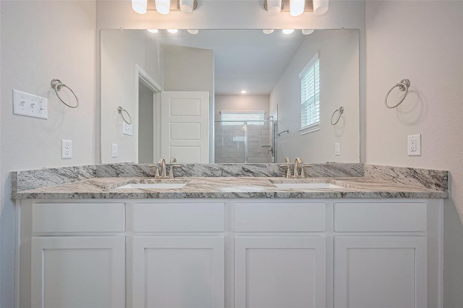 Furnished interior view inside a new home in Sunterra, Katy (Image 8).