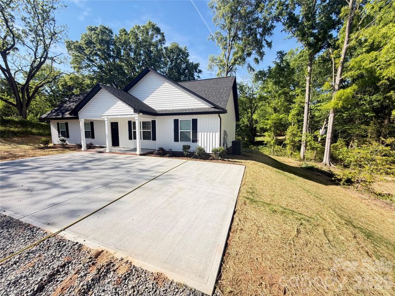 Front exterior of a new home in , Kannapolis, NC, highlighting curb appeal (Image 2). Front exterior of a new home in , Kannapolis, NC, highlighting curb appeal (Image 2).