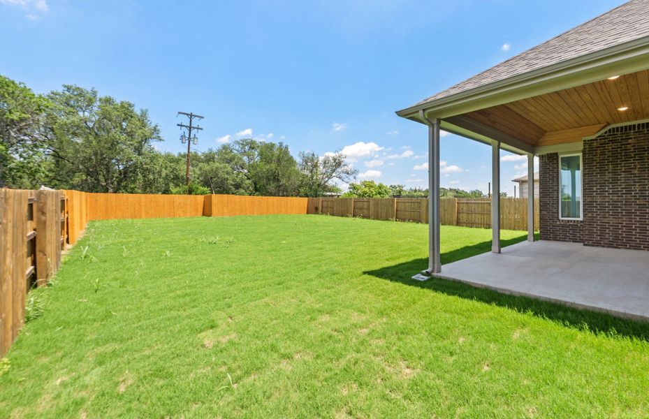 Exterior details and patio area of a home in 6 Creeks, Kyle (Image 4).