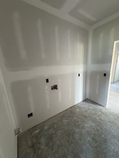 Laundry room connects to primary bedroom. Laundry room connects to primary bedroom.