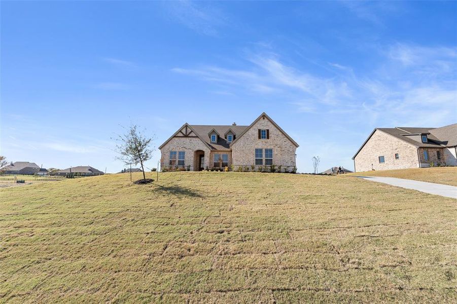 Front exterior of a new home in Creekview Addition, Van Alstyne, TX, highlighting curb appeal (Image 25).