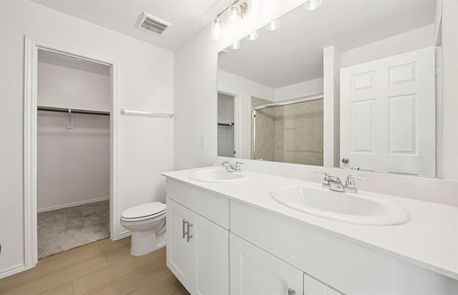 Elegant owner's bathroom with dual vanity *real home pictured Elegant owner's bathroom with dual vanity *real home pictured
