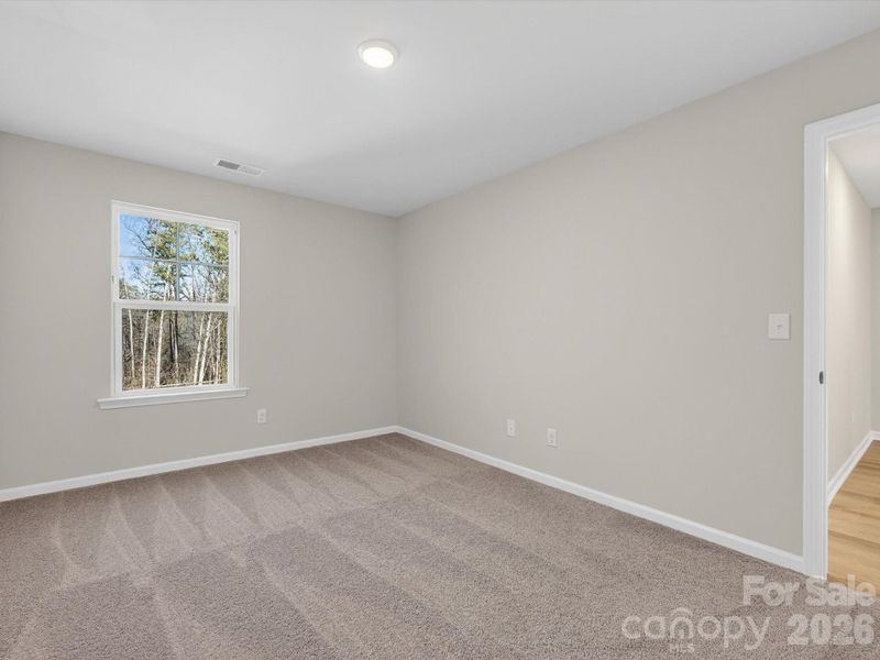 Secondary bedroom with views of the trees