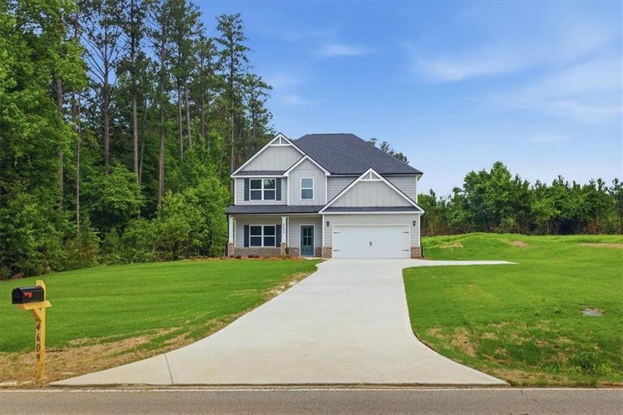 Front exterior of a new home in , Stockbridge, GA, highlighting curb appeal (Image 2). Front exterior of a new home in , Stockbridge, GA, highlighting curb appeal (Image 2).