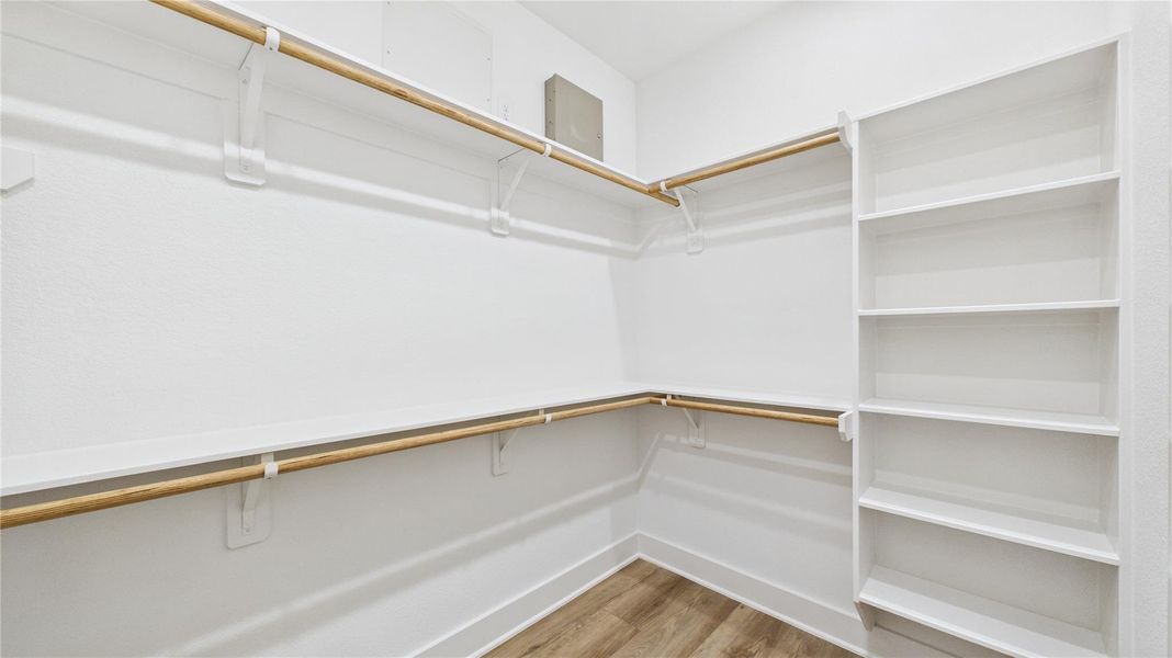 Primary walk-in closet Primary walk-in closet