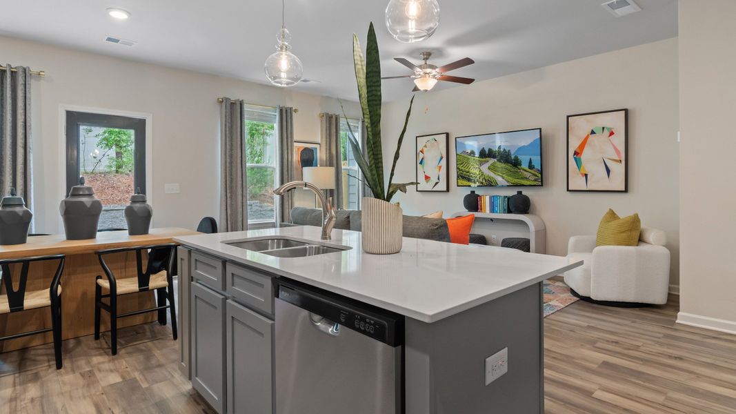 View of kitchen, gathering room, and dining area
