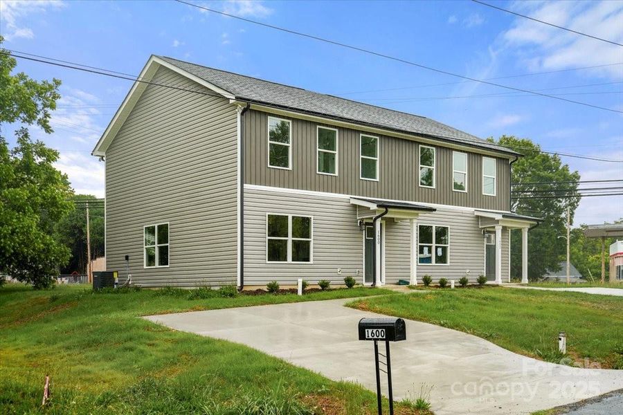 Front exterior of a new home in , Albemarle, NC, highlighting curb appeal (Image 24).